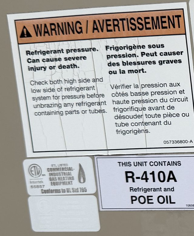Unit label reading This unit contains R-410A refrigerant and POE oil